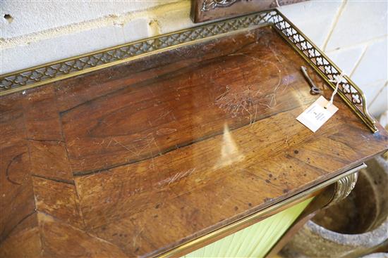 A Regency brass inset rosewood breakfront dwarf bookcase, with pierced brass three quarter gallery, two panelled and two pleated doors,